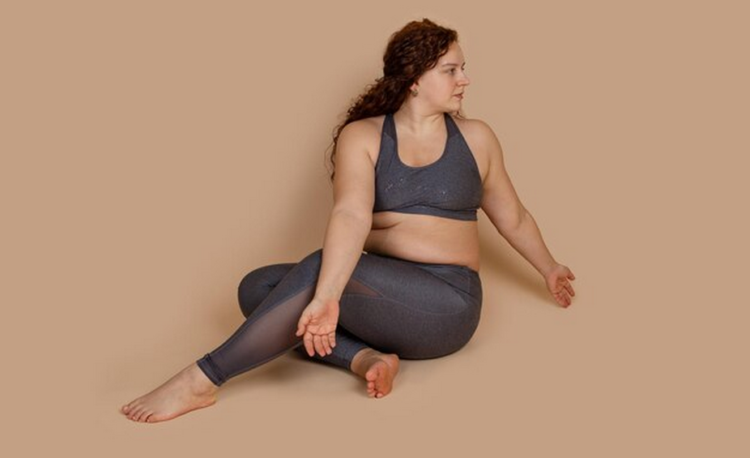 curvy woman practicing yoga.