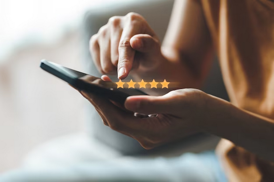 customer giving a five-star rating on smartphone